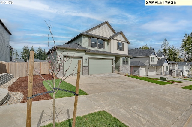 1496 NE Josephine Ct Unit 181, Estacada, OR 97023 - view of front of home featuring driveway, a residential view, stone siding, an attached garage, and board and batten siding