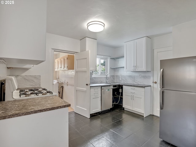 12226 SE Raymond St, Portland, OR 97236 - kitchen featuring appliances with stainless steel finishes, open shelves, backsplash, and a sink