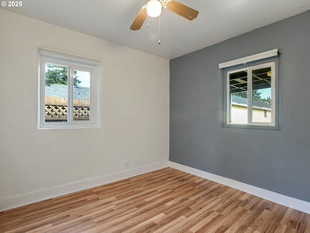 12226 SE Raymond St, Portland, OR 97236 - spare room featuring light wood-style floors, baseboards, and a ceiling fan