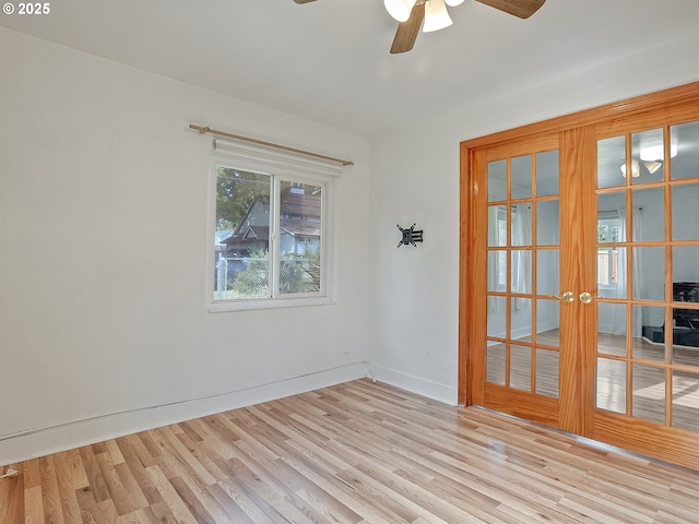 12226 SE Raymond St, Portland, OR 97236 - empty room with ceiling fan, wood finished floors, french doors, and baseboards
