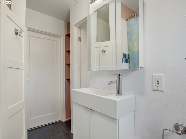 12226 SE Raymond St, Portland, OR 97236 - bathroom with vanity and tile patterned floors