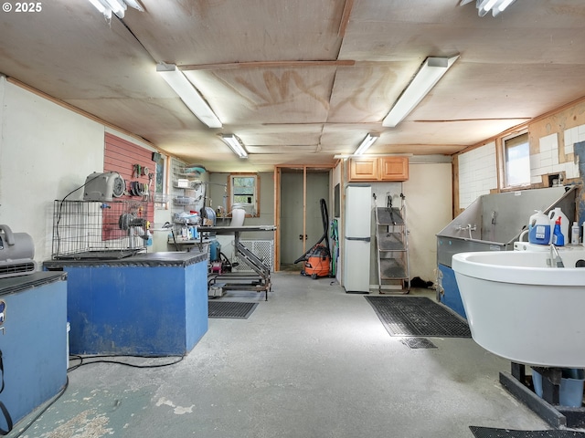 12226 SE Raymond St, Portland, OR 97236 - basement featuring freestanding refrigerator