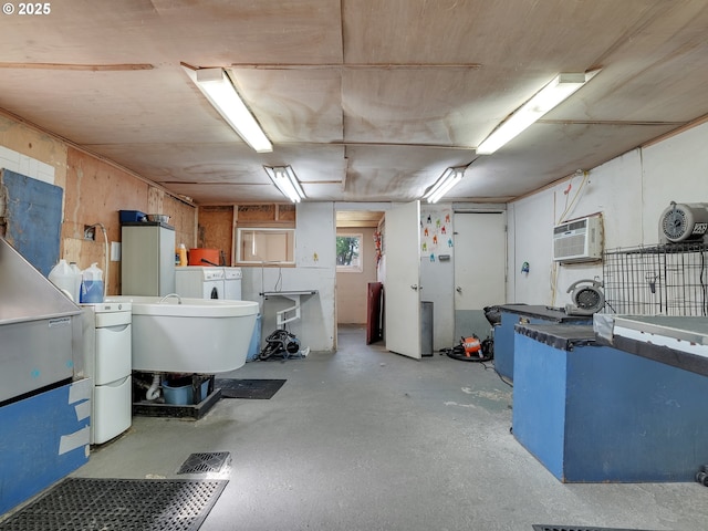 12226 SE Raymond St, Portland, OR 97236 - basement with a wall mounted AC and washing machine and clothes dryer