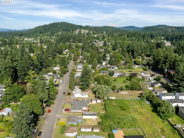 12226 SE Raymond St, Portland, OR 97236 - aerial view of property and surrounding area featuring a forest, a mountain backdrop, and nearby suburban area