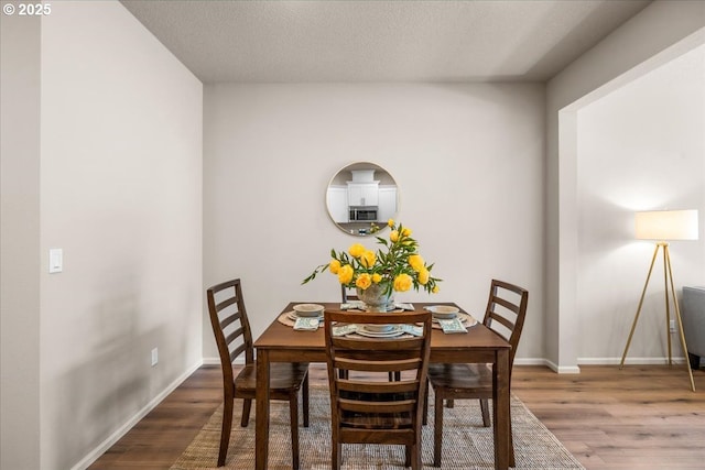 31363 NW N Ave, North Plains, OR 97133 - dining room featuring wood finished floors, baseboards, and a textured ceiling