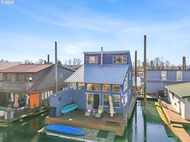 back of house with a water view