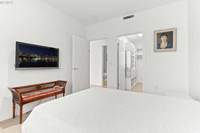 1150 NW Quimby St Unit 442, Portland, OR 97209 - bedroom with baseboards, a spacious closet, and carpet