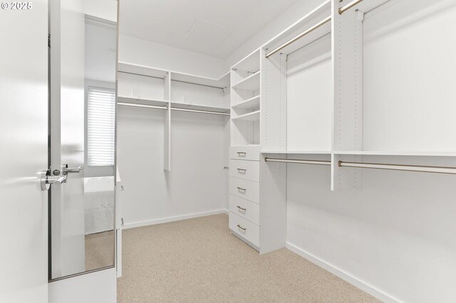 1150 NW Quimby St Unit 442, Portland, OR 97209 - walk in closet featuring light colored carpet