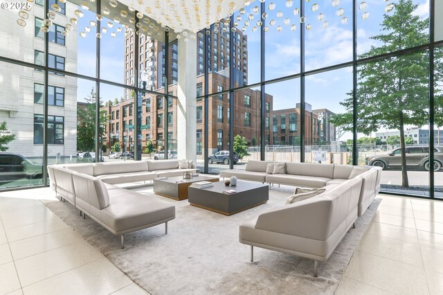 1150 NW Quimby St Unit 442, Portland, OR 97209 - tiled living area with floor to ceiling windows and a high ceiling
