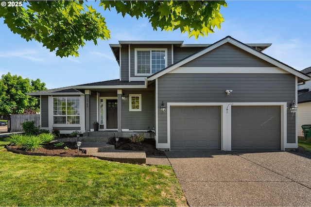 traditional-style house with an attached garage and concrete driveway