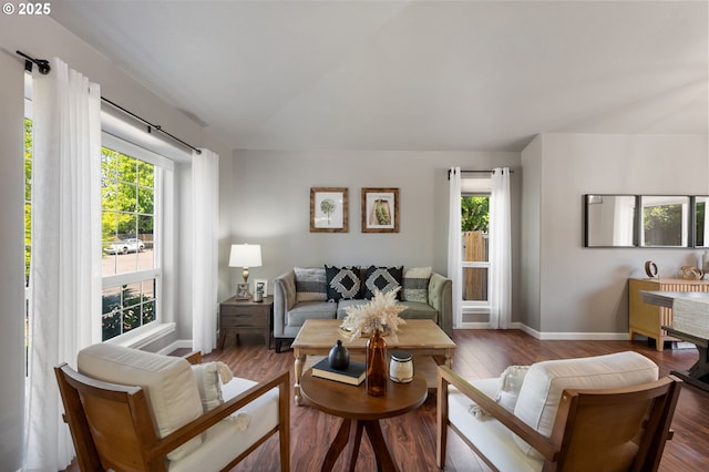 living room with baseboards and wood finished floors