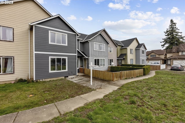 view of property with crawl space, a front yard, and a residential view