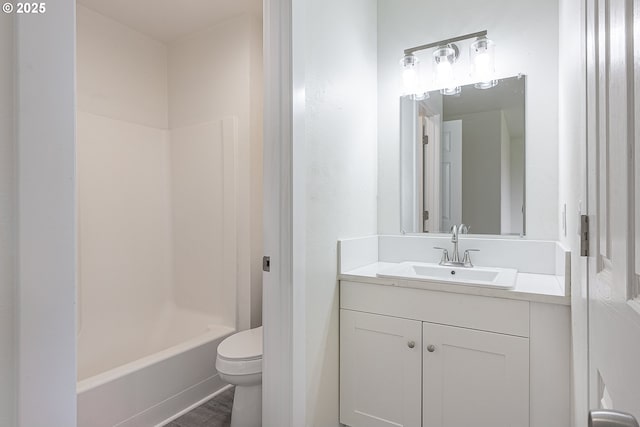 bathroom with toilet and vanity