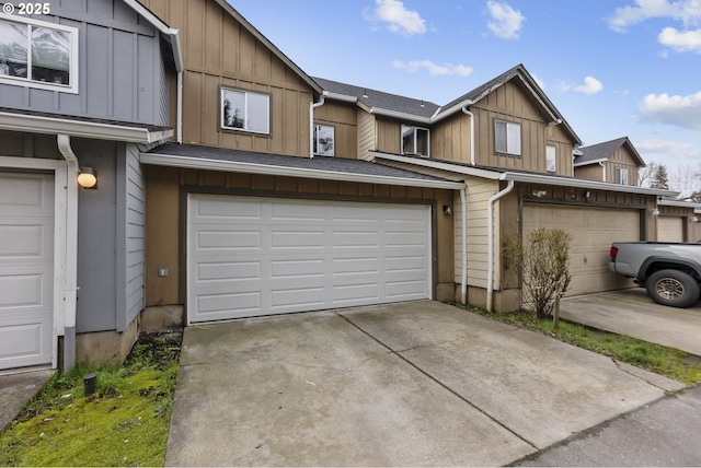 multi unit property featuring board and batten siding, roof with shingles, driveway, and an attached garage