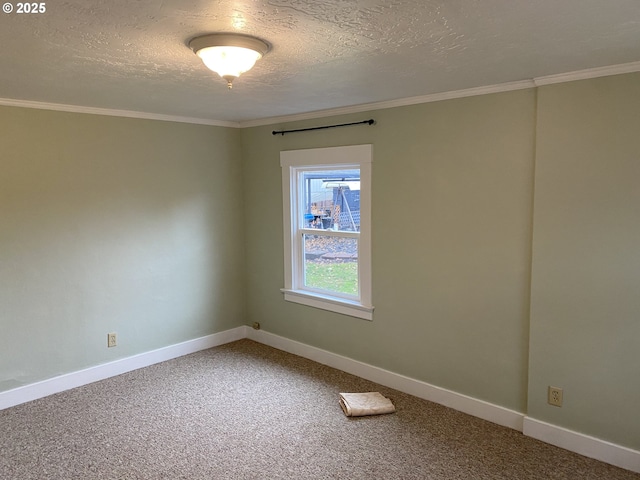 carpeted empty room with a textured ceiling, crown molding, and baseboards