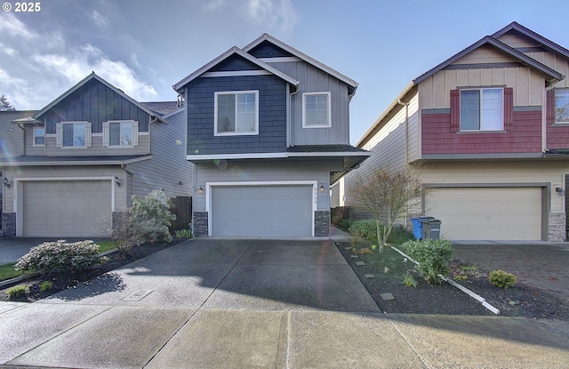 craftsman inspired home featuring stone siding, board and batten siding, and an attached garage