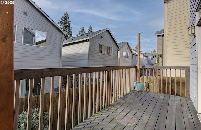 wooden deck with a residential view