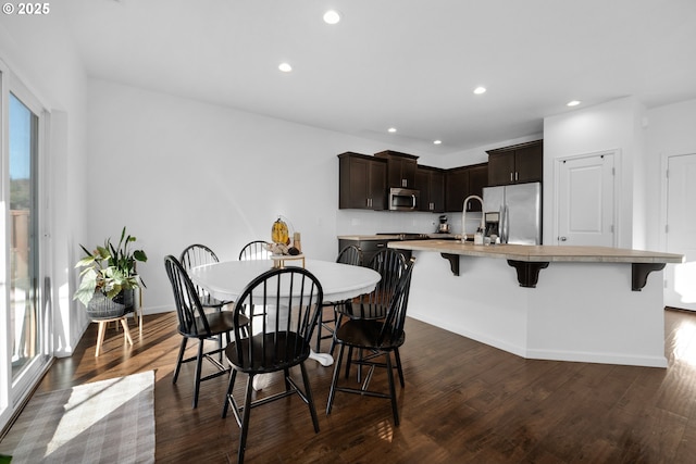 dining area with dark hardwood / wood-style floors