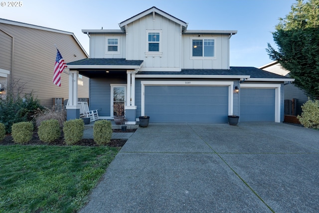 view of front of house featuring a porch and a garage