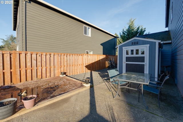 view of patio with a shed