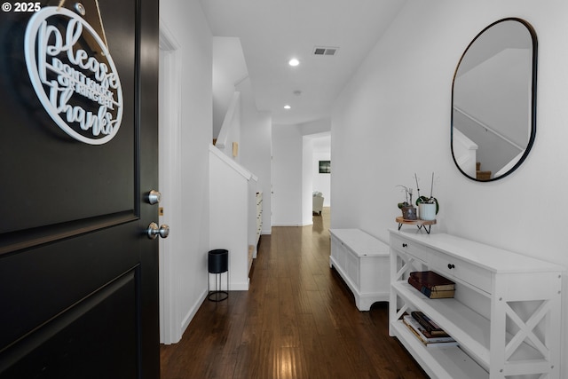 foyer entrance with dark hardwood / wood-style floors