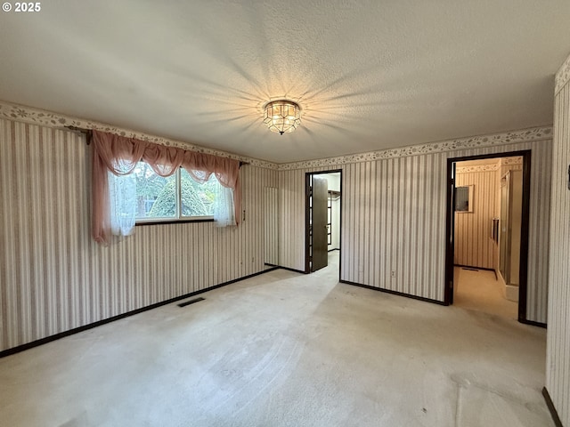 5235 SE 32nd Ave, Portland, OR 97202 - spare room featuring wallpapered walls and light carpet