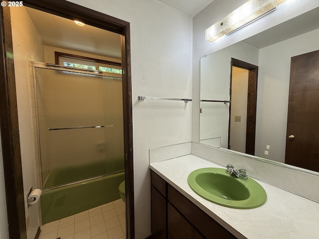 5235 SE 32nd Ave, Portland, OR 97202 - bathroom featuring vanity, enclosed tub / shower combo, and tile patterned flooring