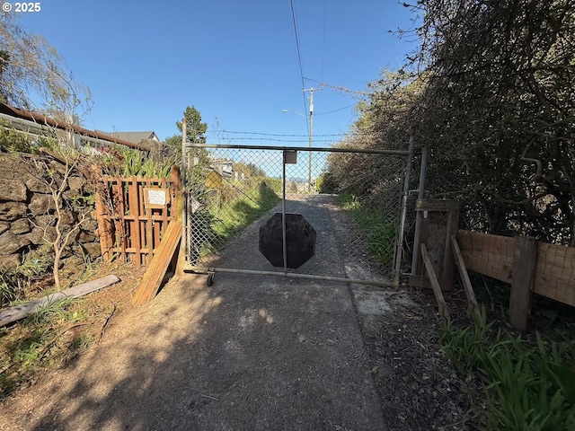 view of gate with fence
