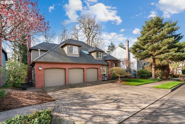 view of front of property featuring a garage, brick siding, driveway, and a shingled roof