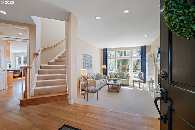 5666 Grand Oaks Dr, Lake Oswego, OR 97035 - foyer entrance with stairway, recessed lighting, light wood-style flooring, and baseboards