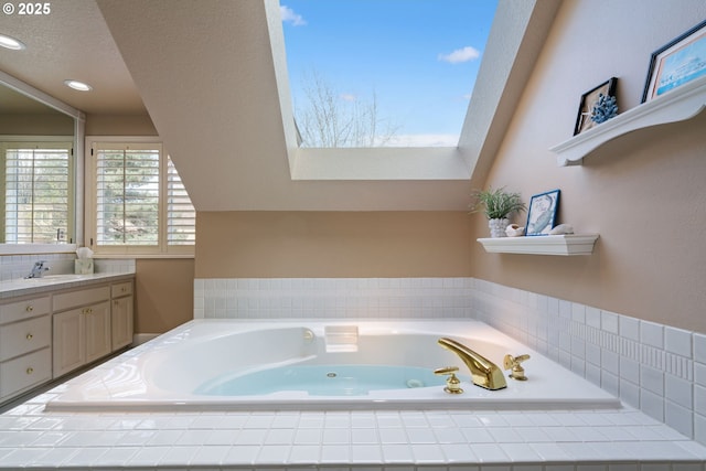 5666 Grand Oaks Dr, Lake Oswego, OR 97035 - bathroom featuring vanity, a jetted tub, a skylight, recessed lighting, and a textured ceiling