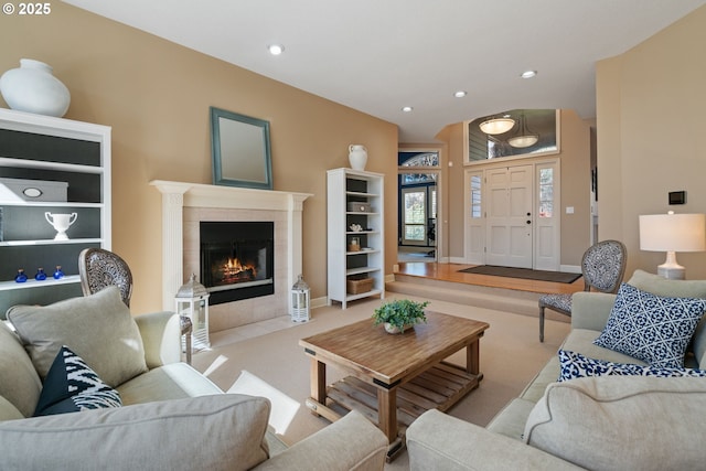 5666 Grand Oaks Dr, Lake Oswego, OR 97035 - living area featuring a tiled fireplace, recessed lighting, carpet, and baseboards