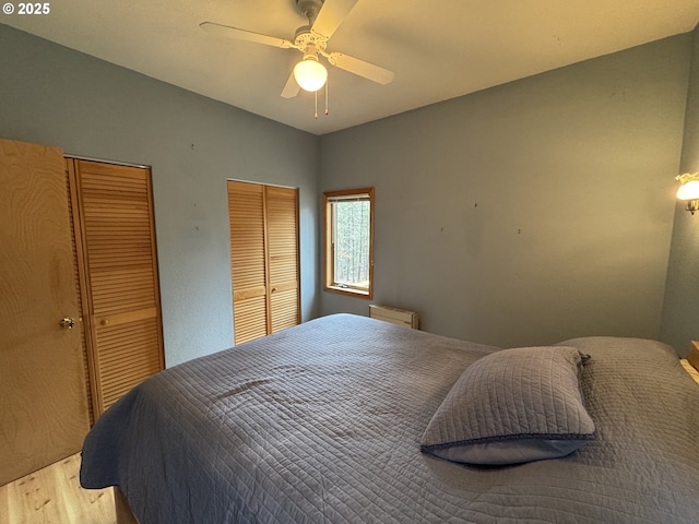 118 Noble Fir, Goldendale, WA 98620 - bedroom featuring multiple closets, wood finished floors, and a ceiling fan