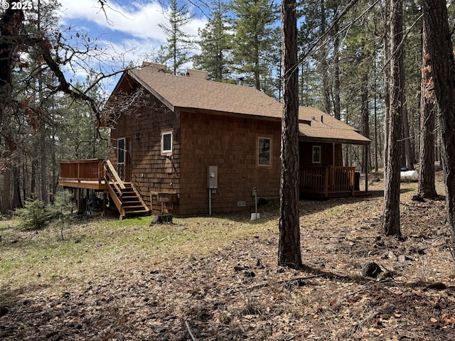 118 Noble Fir, Goldendale, WA 98620 - view of home's exterior featuring a deck, roof with shingles, and stairs