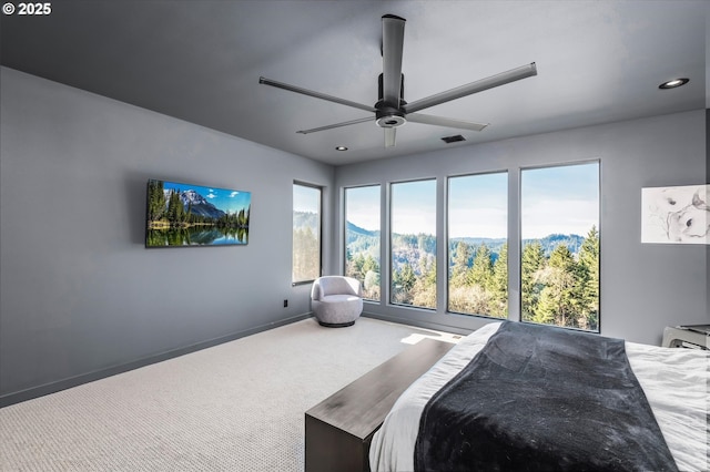 bedroom featuring ceiling fan and carpet