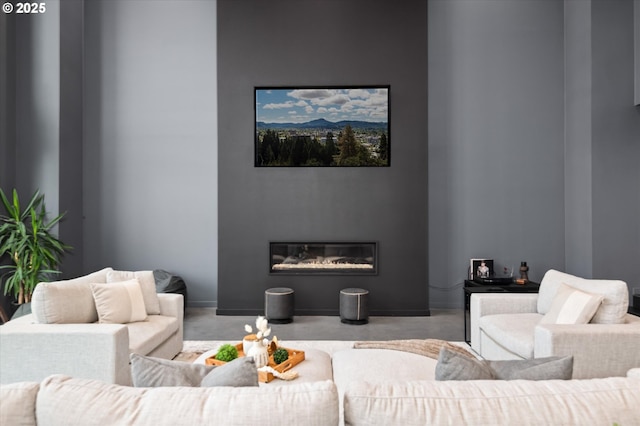 living room featuring concrete flooring