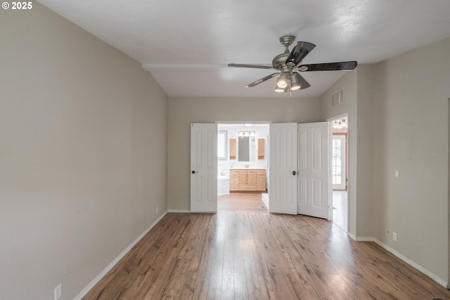 3472 Juniper St, Sweet Home, OR 97386 - unfurnished bedroom with wood finished floors, baseboards, and ensuite bathroom