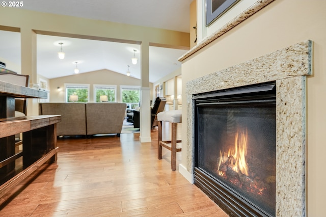 3664 W Chinook Ave, Cannon Beach, OR 97110 - living room with a high end fireplace, lofted ceiling, and light wood-type flooring