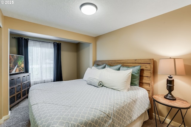 3664 W Chinook Ave, Cannon Beach, OR 97110 - carpeted bedroom featuring a textured ceiling and baseboards