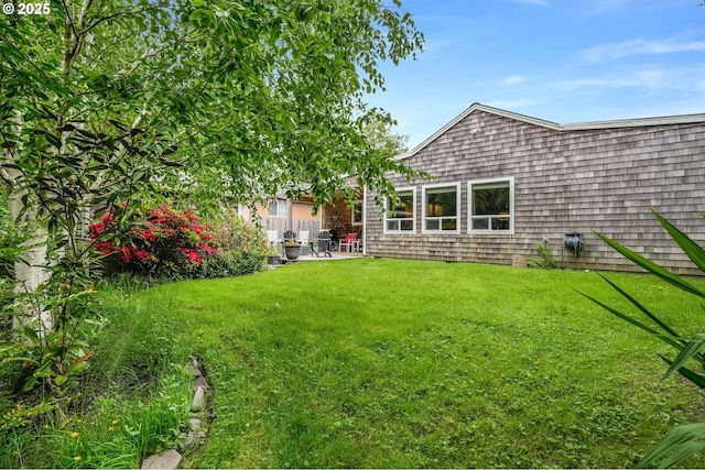 3664 W Chinook Ave, Cannon Beach, OR 97110 - view of green lawn featuring a patio area