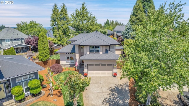 23836 SW Warbler Pl, Sherwood, OR 97140 - view of front of home featuring roof with shingles, concrete driveway, an attached garage, and a residential view