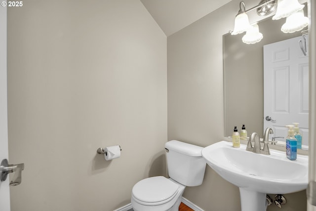 23836 SW Warbler Pl, Sherwood, OR 97140 - half bath with toilet, a sink, lofted ceiling, and baseboards