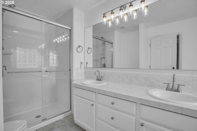 23836 SW Warbler Pl, Sherwood, OR 97140 - full bath featuring double vanity, a stall shower, toilet, and tile patterned floors