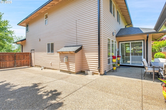 23836 SW Warbler Pl, Sherwood, OR 97140 - view of property exterior featuring a patio area and a gate