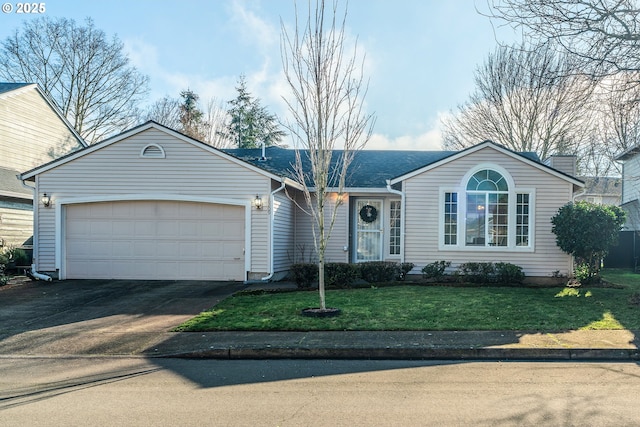 ranch-style house with a garage and a front yard