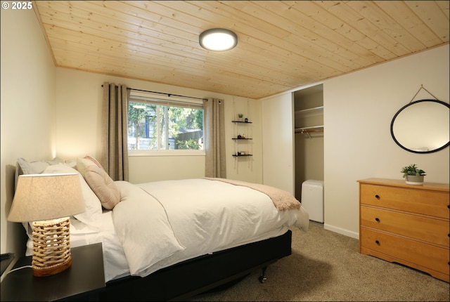 carpeted bedroom with wood ceiling and a closet