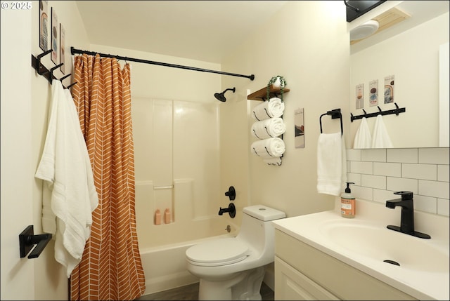 full bathroom featuring tasteful backsplash, vanity, toilet, and shower / bathtub combination with curtain