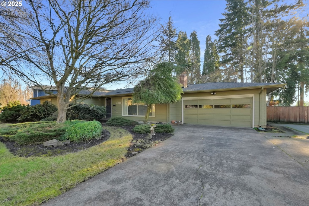 single story home with a garage