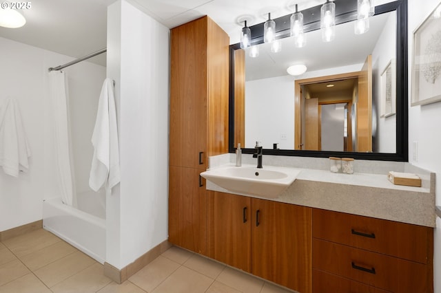 bathroom featuring sink, shower / bath combination with curtain, and tile patterned flooring