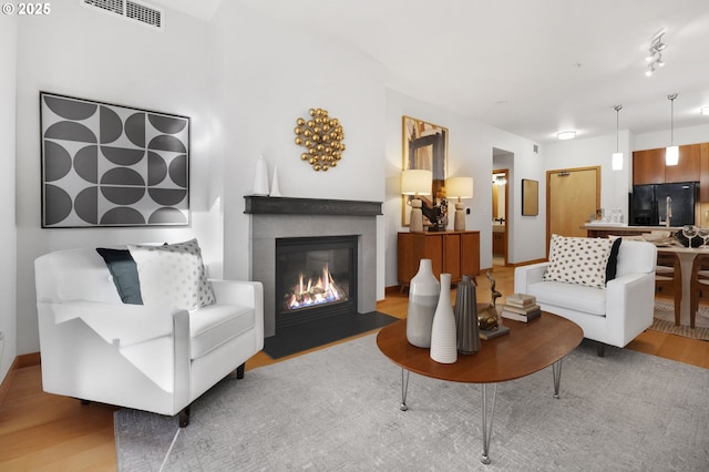 living room with light hardwood / wood-style floors